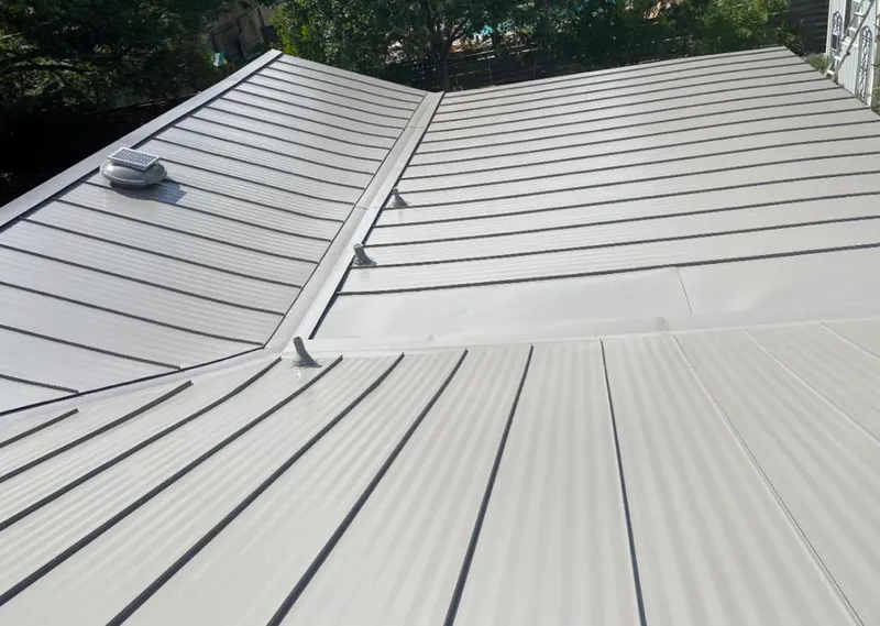 Solar attic fan installed on a metal roof for Roof Ventilation in Upper Moreland